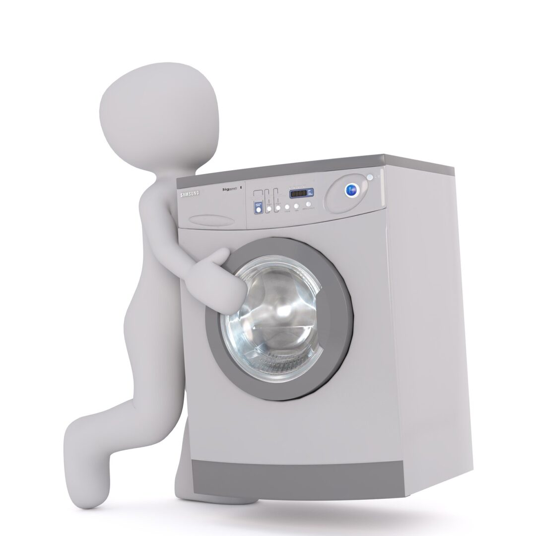 A person is holding on to the front of a washing machine.