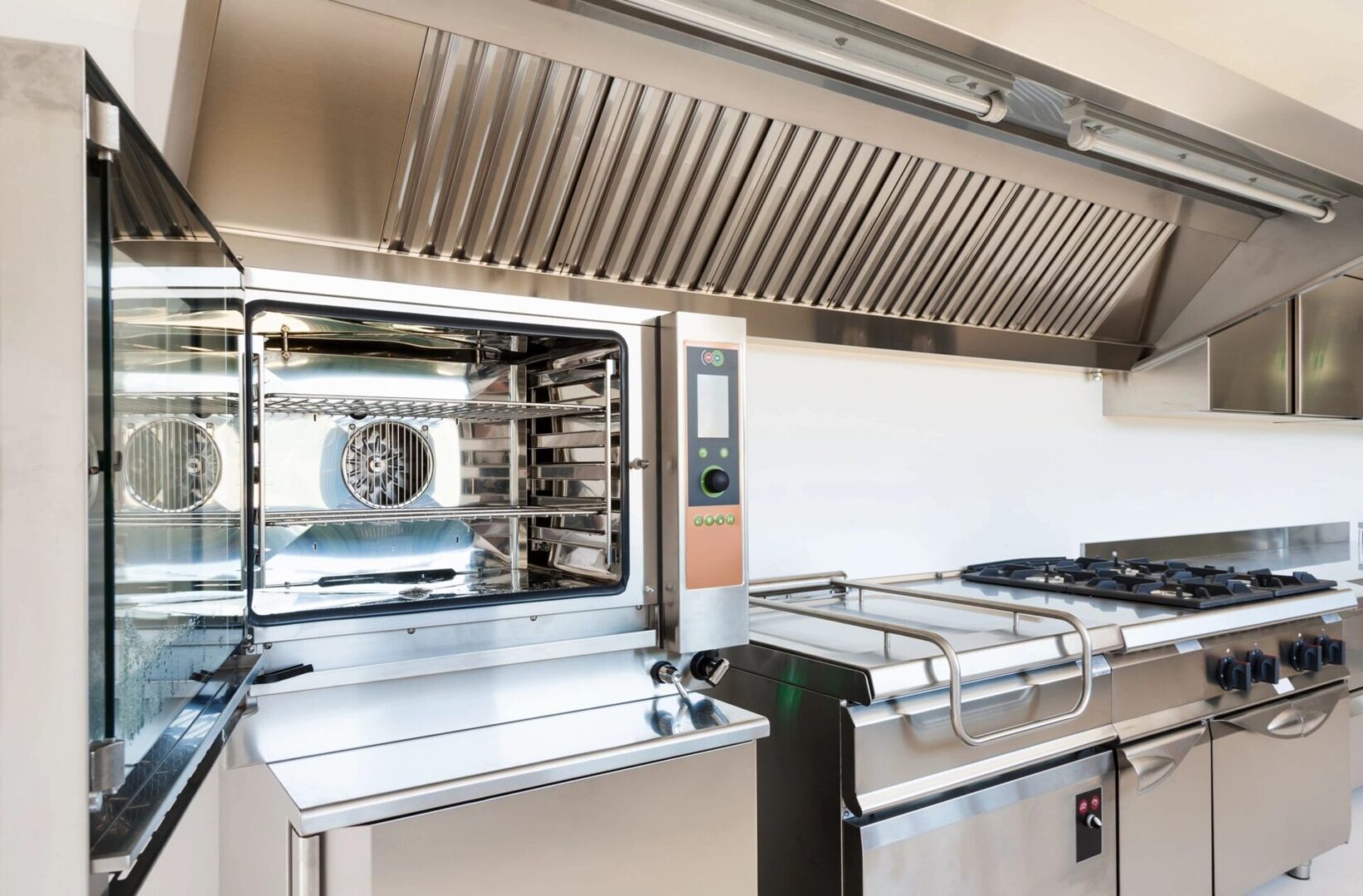 A kitchen with many different types of appliances.