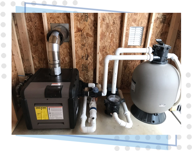 A pool pump and filter system in the corner of a room.